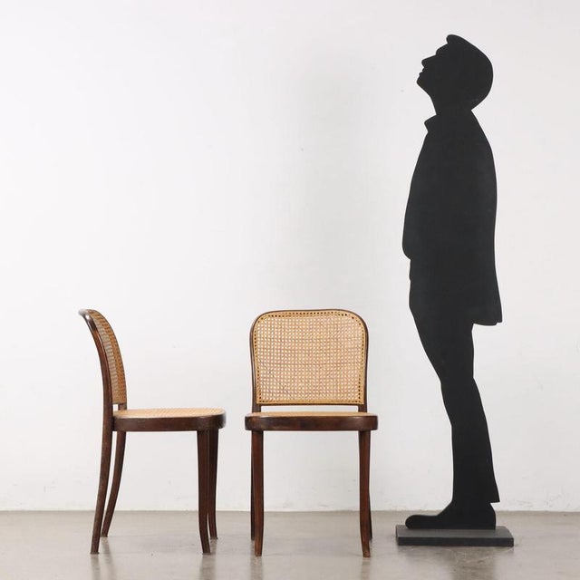 Group of Thonet style chairs with stained beech wood frame, seat and back in Vienna straw. This piece is attributed to the...