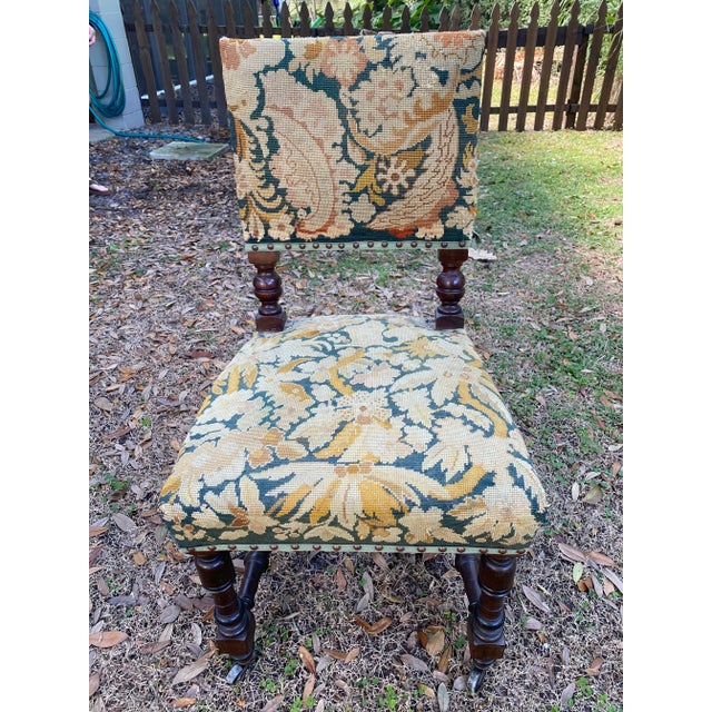 Late 1980’s English needlepoint game chairs. Exquisite detailing. Set of 4 with hues of deep teal, gold and tan.