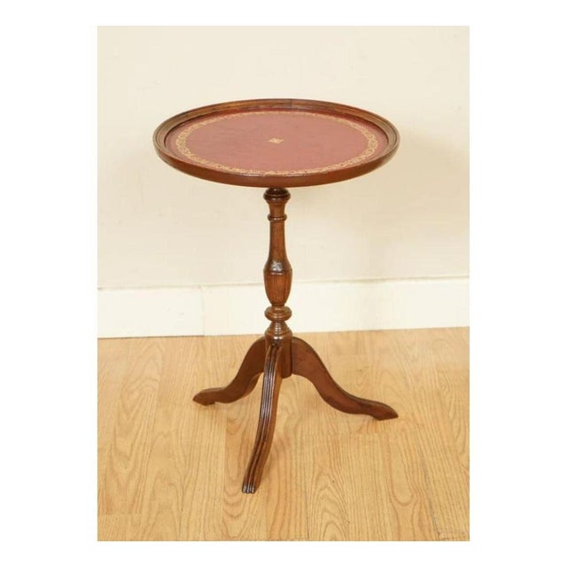Lovely leather tripod legs. A beautiful side or end table, the leather was replaced by the previous owner. The rest of the...