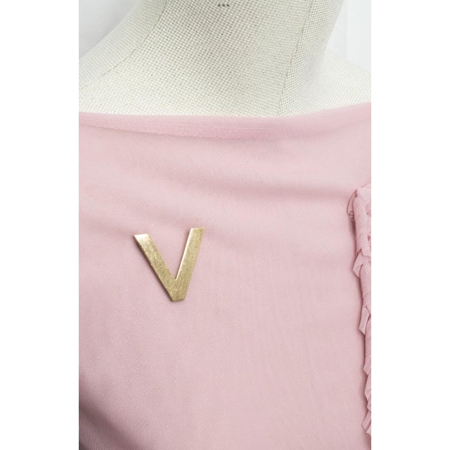 Rare and historically significant brooch by Tiffany & Co., crafted in 14K gold during World War II. This “V” design stands...