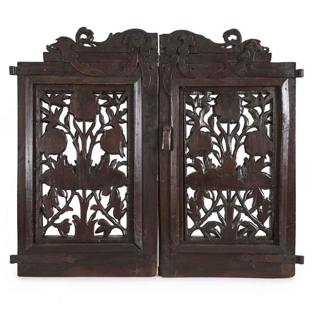 A 18th-century carved wooden gate from a Lombard workshop with two leaves, originally from a church altar, carved and...