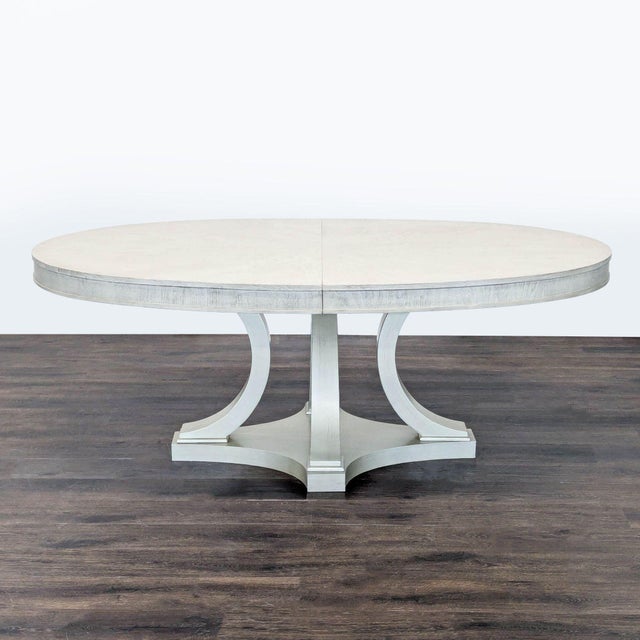 Comes with one leaf that expands table to 98 inches. It is crafted of hardwood solids with walnut veneers in a shadow grey...