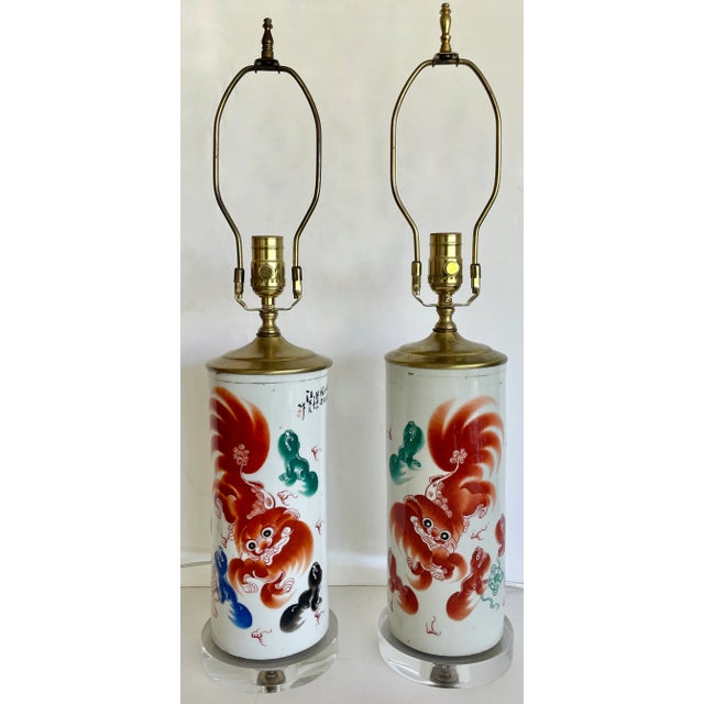 Lovely set of 2 Asian ceramic table lamps from 60's. Hand painted with different patterns and vivid colors. Newly...