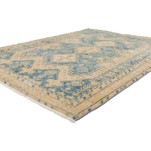 61121 Distressed Vintage Persian Viss Rug, 04'10 x 06'07. Tribal mystique meets laid-back luxury in in this hand knotted...