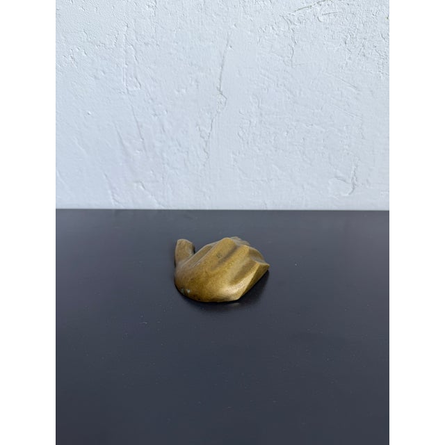 Modern patinated bronze sculpture of a hand with bottle opener on the reverse. Signed by Brazilian plastics artist...