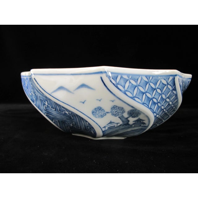 Chinese blue and white porcelain sculpted bowl with floral and bamboo design, made for Gumps. Measures 9" x 3". Excellent...