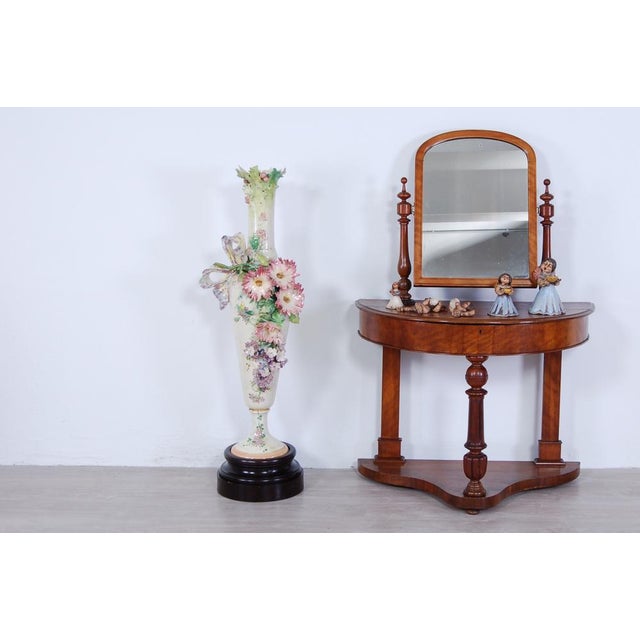 Large vessel made of terracotta and clay with barbottine technique, with numerous floral elements in relief and large side...