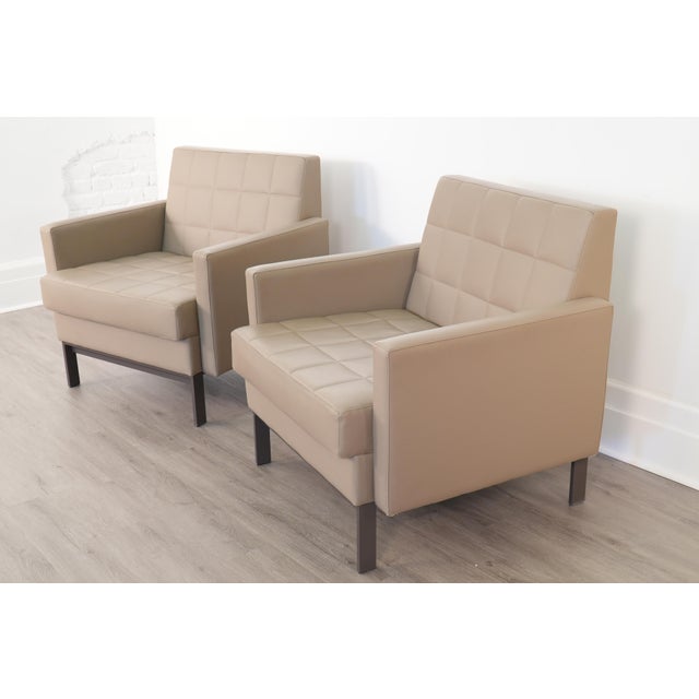 A stylish pair of Millbrae lounge chairs by Coalesse, a Steelcase brand, with a clean modern design that fits comfortably...