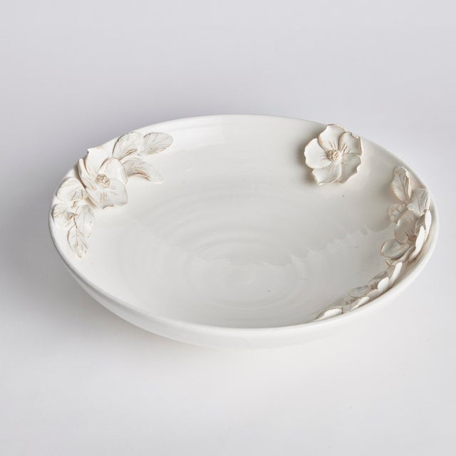 Each and every dogwood flower and leaf detail of the Fiori Decorative Grande Bowl is handmade, and hand-applied by Italian...
