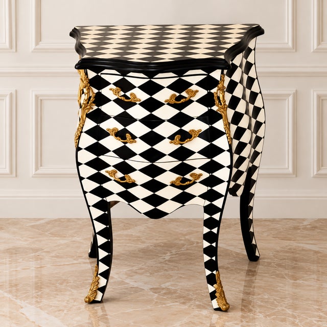 Make a statement this Halloween with this striking French-style decorative commode, featuring a dramatic black-and-white...