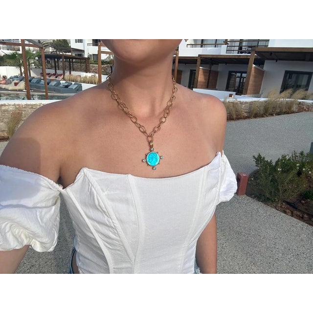 One of our favorite Intaglios, Apollo, in a beautifully vibrant blue. Accented with brilliantly faceted Brazilian Blue...