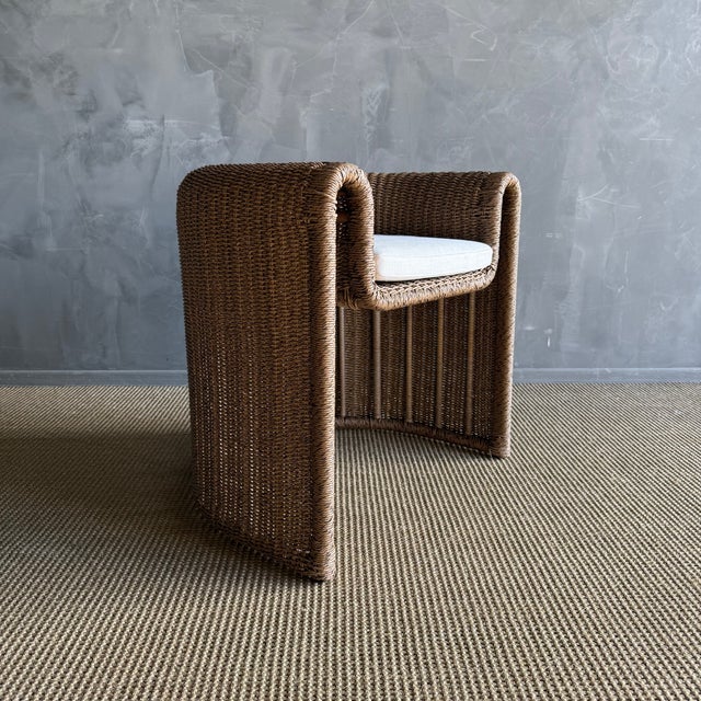 This outdoor woven rope dining chair combines comfort and style in a beautifully rounded design, perfect for enhancing...