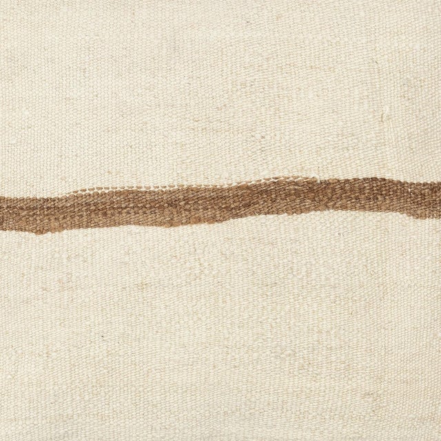 Add a touch of history and warmth to your space with this vintage handmade Turkish hemp kilim cushion cover. Crafted from...