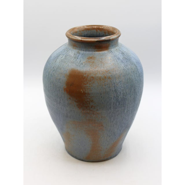 Circa 1980s "Seagrove" Pottery large turned vase by Walter & Dot Auman. An outstanding striated smalt blue with browns...