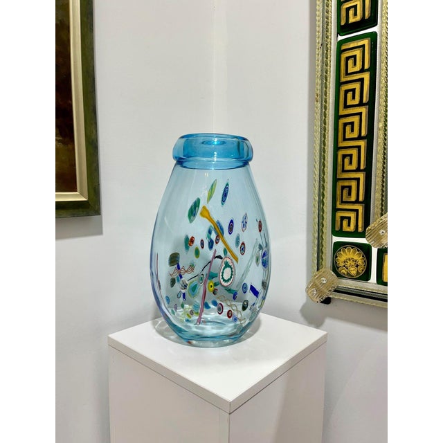 Price reduced $400. Now only $799! Gorgeous light blue Murano Glass Vase with millefiore decoration. Vintage piece which...