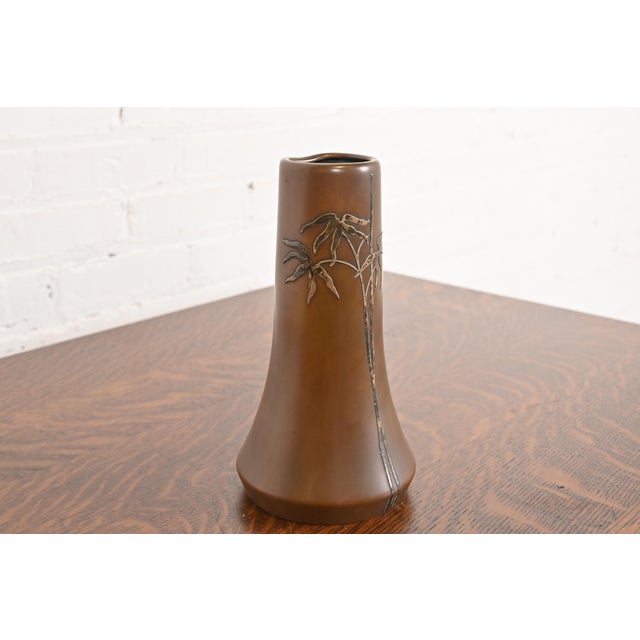 A beautiful Arts & Crafts period sterling silver on bronze vase with floral design By Heintz Art Metal Shop USA, Early...