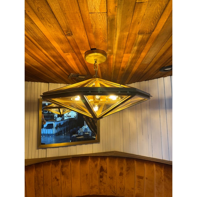 RH Helena Chandeler in lacquered, burnished brass with panels of smoky rose beveled glass set in a hexagonal frame. This...