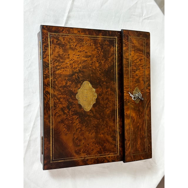A beautiful Napoleon III writing desk dating from around 1880, crafted from burr walnut with magnificent grain. The lid is...