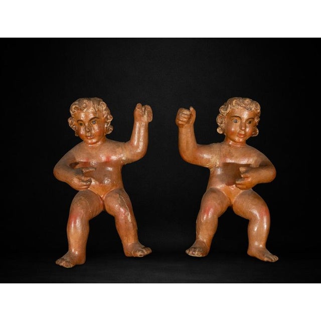 A charming pair of Spanish Baroque carved wooden cherubs dating from the 17th century. Each figure is hand-carved in solid...