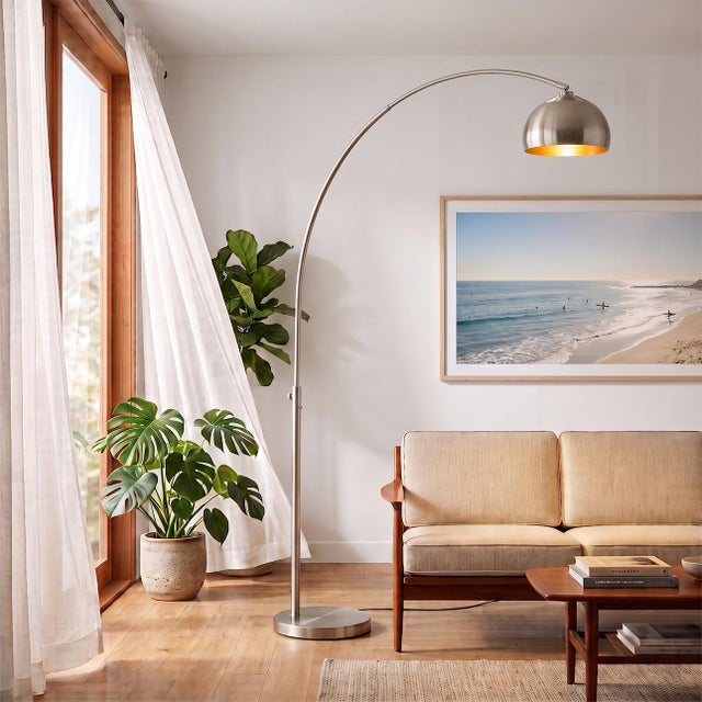 The Half Dome Arc Lamp is a modern arc lamp designed by Peter Morelli in 1960. This elegant fixture features a sweeping,...