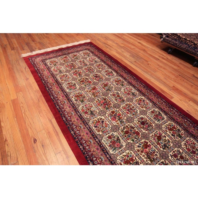 Impressive Fine Long Narrow Gallery Size Vintage Garden Design Silk Persian Qum Rug, country of origin: Persian Rugs,...