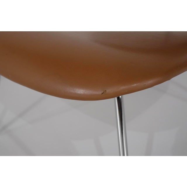 Pair of "lcm" lounge chairs in caramel-colored leather (skai), a choice that adds a touch of refinement and extra comfort,...