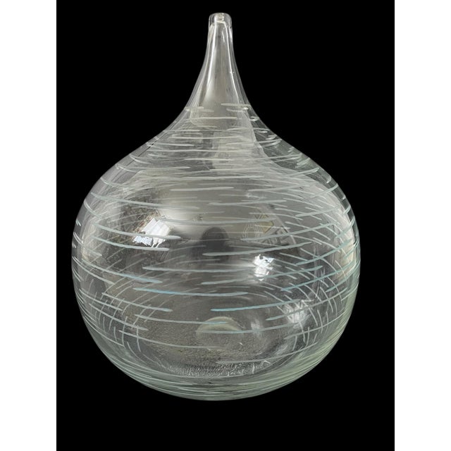 This vintage MCM Belgium handblown glass vase features an abstract etched design, making it a unique and artistic addition...