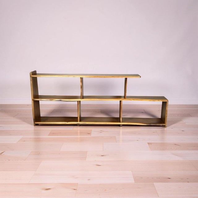 This striking vintage bookshelf blends the clean lines of Mid-Century Modern design with the organic warmth of live edge...