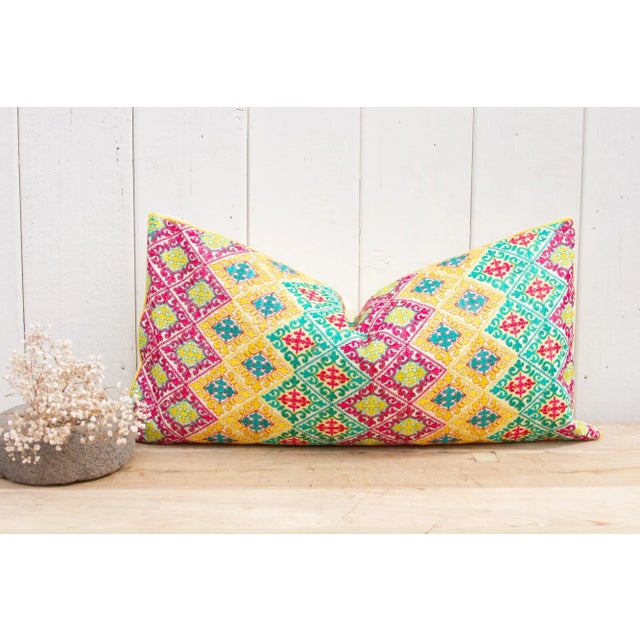 This Swati tribal pillow was created using intricately embroidered fabric from Swat Valley, where "phulkari" embroidery...