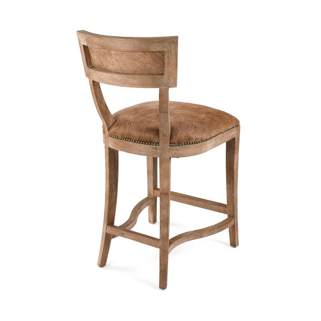 Bring an air of rustic luxury to your space with cow hide counter stool, a stunning blend of traditional craftsmanship and...