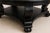 Elegant and timeless, this vintage round pedestal coffee table has been professionally refinished in a rich satin black...