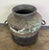 A striking antique copper storage vessel, hand-forged with a beautifully timeworn surface and rich verdigris patina. This...