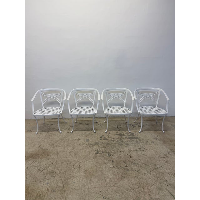 Set of four original Brown Jordan outdoor white powder coated aluminum dining chairs circa 1960s. Seat Height: 15.25"