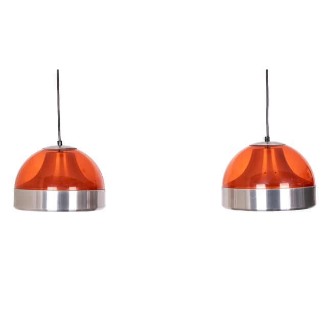 Space Ace to the top. Very nice set of Pendant lamps. Orange acrylic shades. Comes with perforated aluminum inner shades....