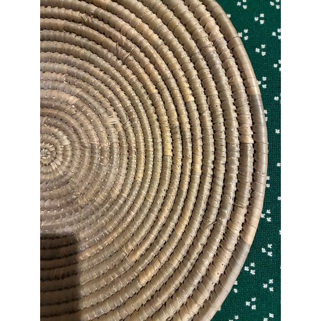 A very large handmade Bahamian basket created by the well known Plait Lady, Omelia Marshall who died at the age of 97. She...