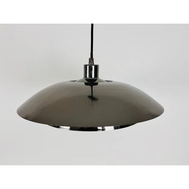 Danish chrome metal pendant lamp made in the 1980s.. The fixture gives a very beautiful light. It is made from thin...
