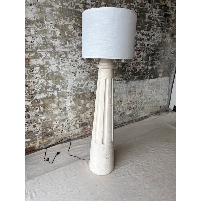 Striking vintage floor lamp inspired by classical Greek column architecture, featuring a tall tapered pedestal base,...