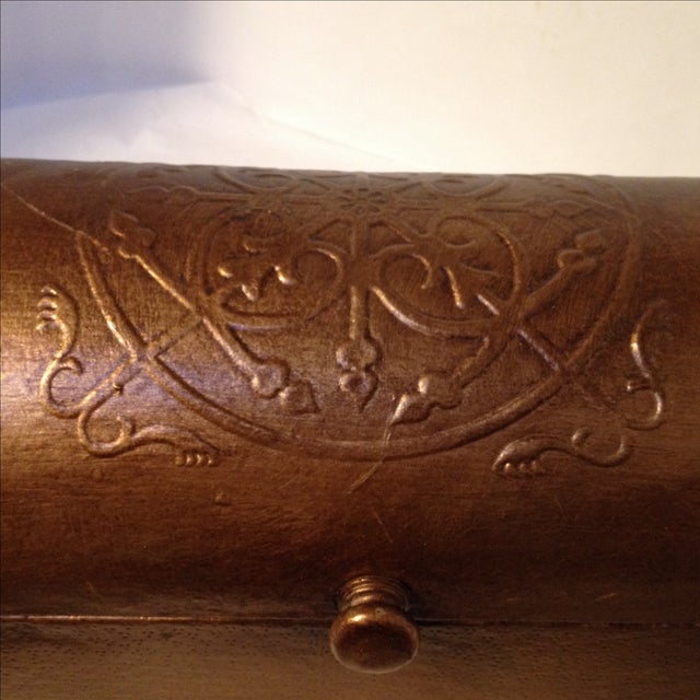 Really unique embossed Chest by Sarreid. Has Metallic copper finish color Leather covering the whole chest. Feels very...