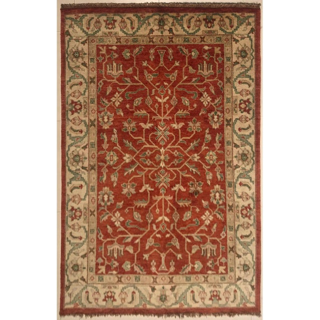 This artisan carpet was manufactured in India.