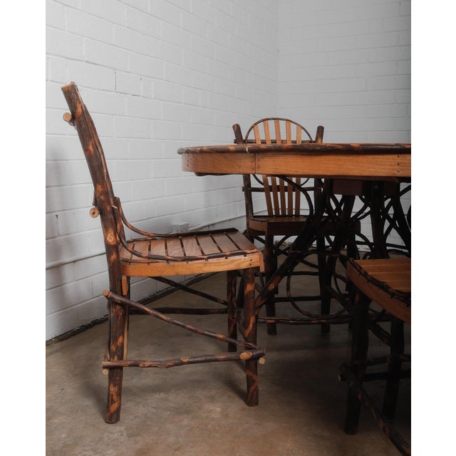 Elevate your rustic kitchen with these stunning Amish Adirondack style dining chairs and table, where the artistry of...