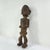 The Azande figure was hand-carved by the Azande artisans of the Democratic Republic of the Congo, but the Azande community...