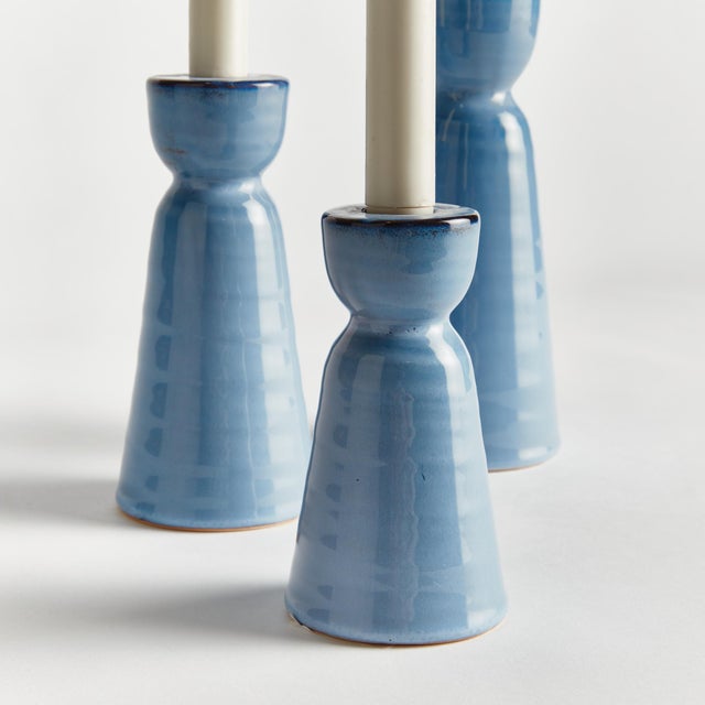 Made of a highfired, durable stoneware, and finished with a dynamic reactive glaze, these candle stands are a beautiful...