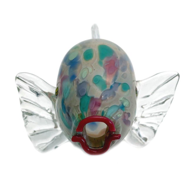 This hand blown Murano Puffer Fish measures W: 7" D: 6" H: 4". Clear with mostly pastel colors. In excellent condition.