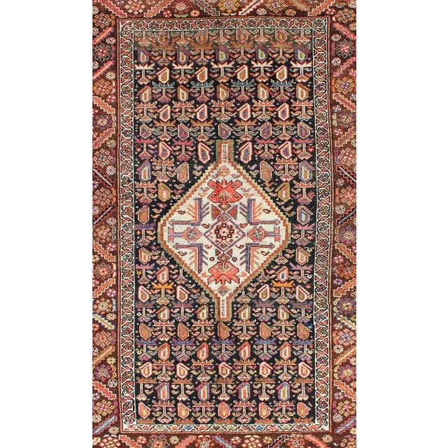 Geometric antique Kurdish rug from Persia with medallion and all-over design, rug ema-7570, Keivan Woven Arts country of...