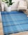 Maya Opulent Blue Flatweave Wool Rug, Country of Origin: India. This exceptional flatweave piece showcases the...