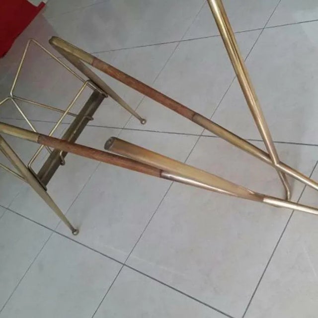 Very rare original 1960s magazine rack living room table designed by Cesare Lacca and made in the usual mix of brass and...