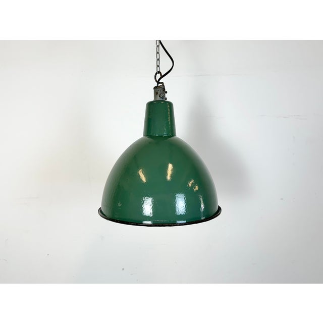 Industrial green enamel pendant light made by A23 factory in Wilkasy in Poland during the 1960s. White enamel inside the...