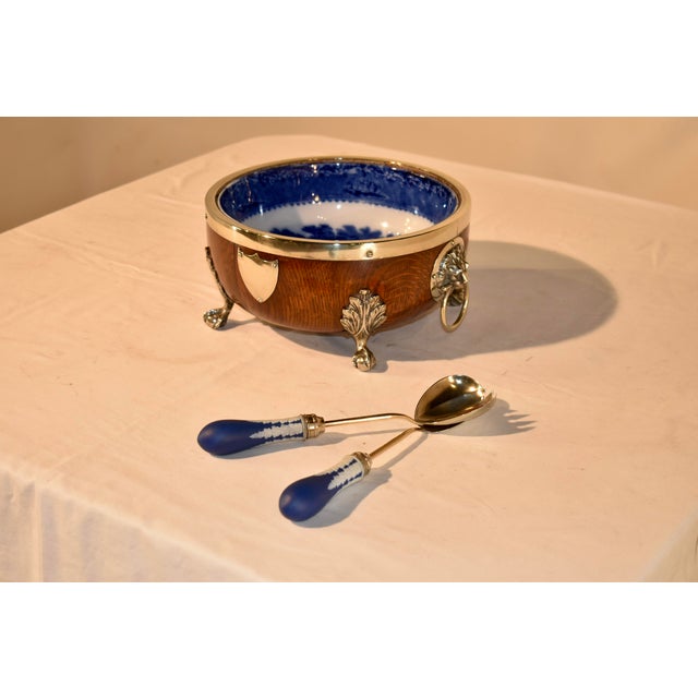 Period Edwardian turned oak serving bowl with silver plated rim, feet and handles. The bowl insert is a blue and white...