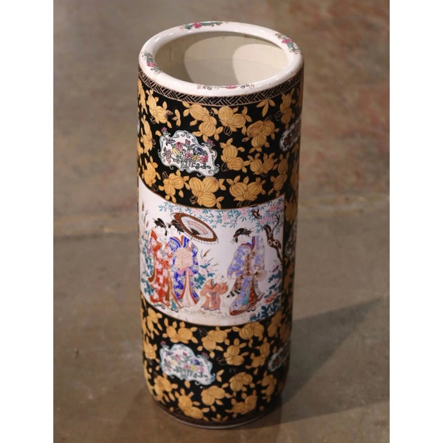 Created in China circa 1950, this large colorful Famille Rose umbrella stand is round in shape and features hand painted...