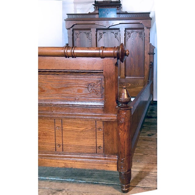 This dramatic, monumental bestead is full of fanciful details including chamfering, incised carving, exotic ebony and...